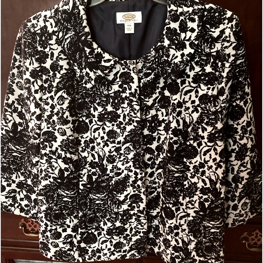Jacket is by has three qtr. sleeves navy blue floral print on white